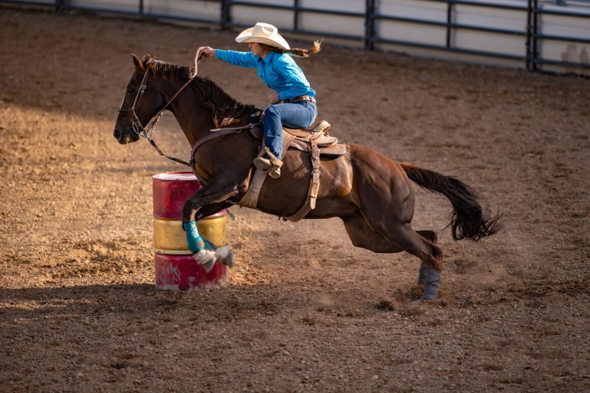 Woman barrel racing with her quarter horse