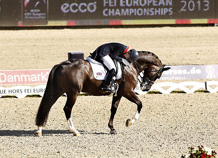 Charlotte Dujardin hugging Valegro after a performance